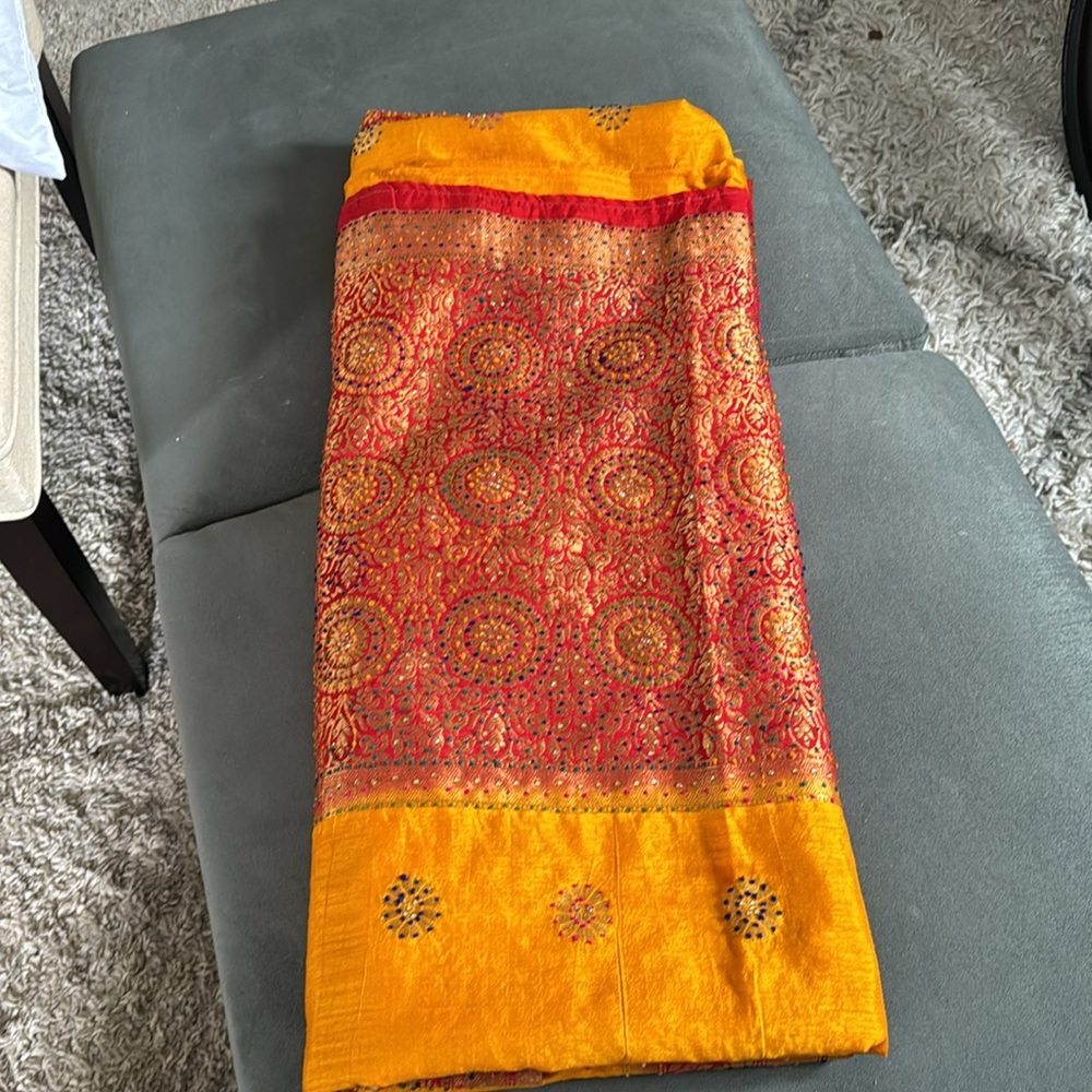 Yellow saree with red border